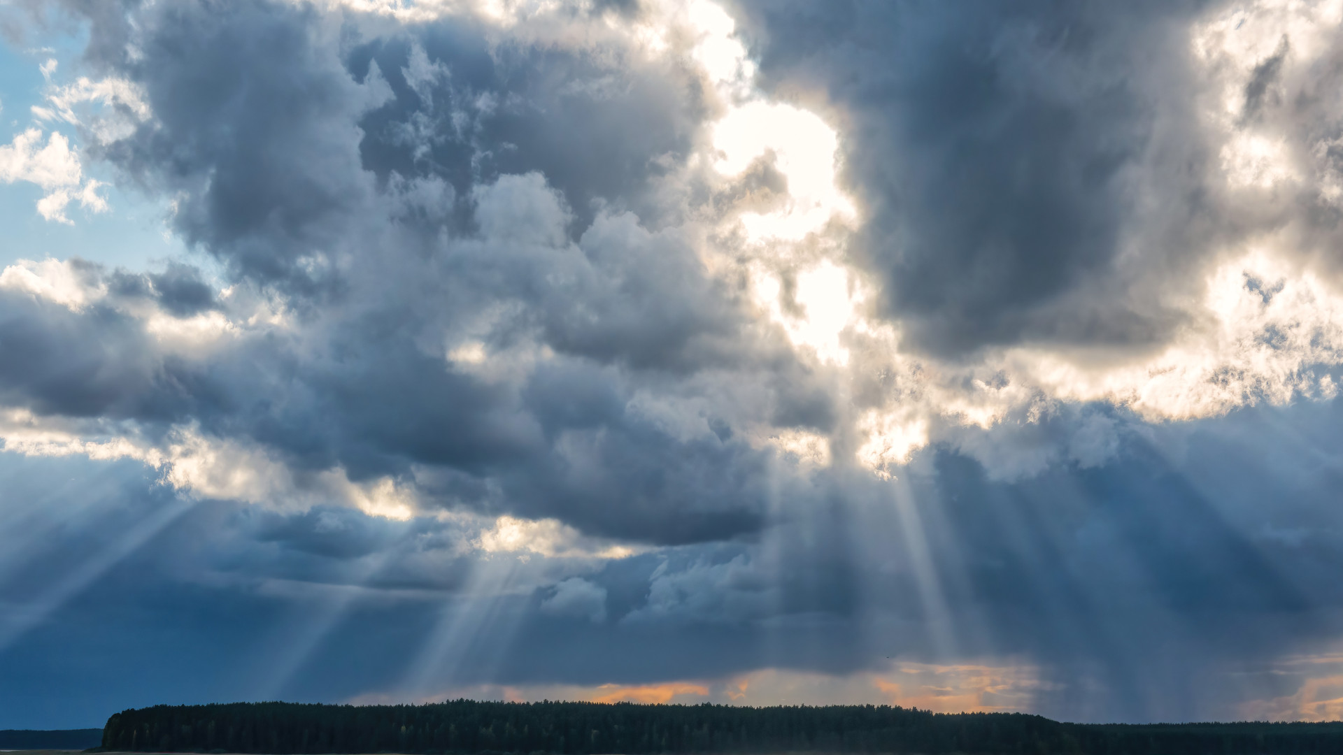 Rays of sunshine breaking through a cloudy sky